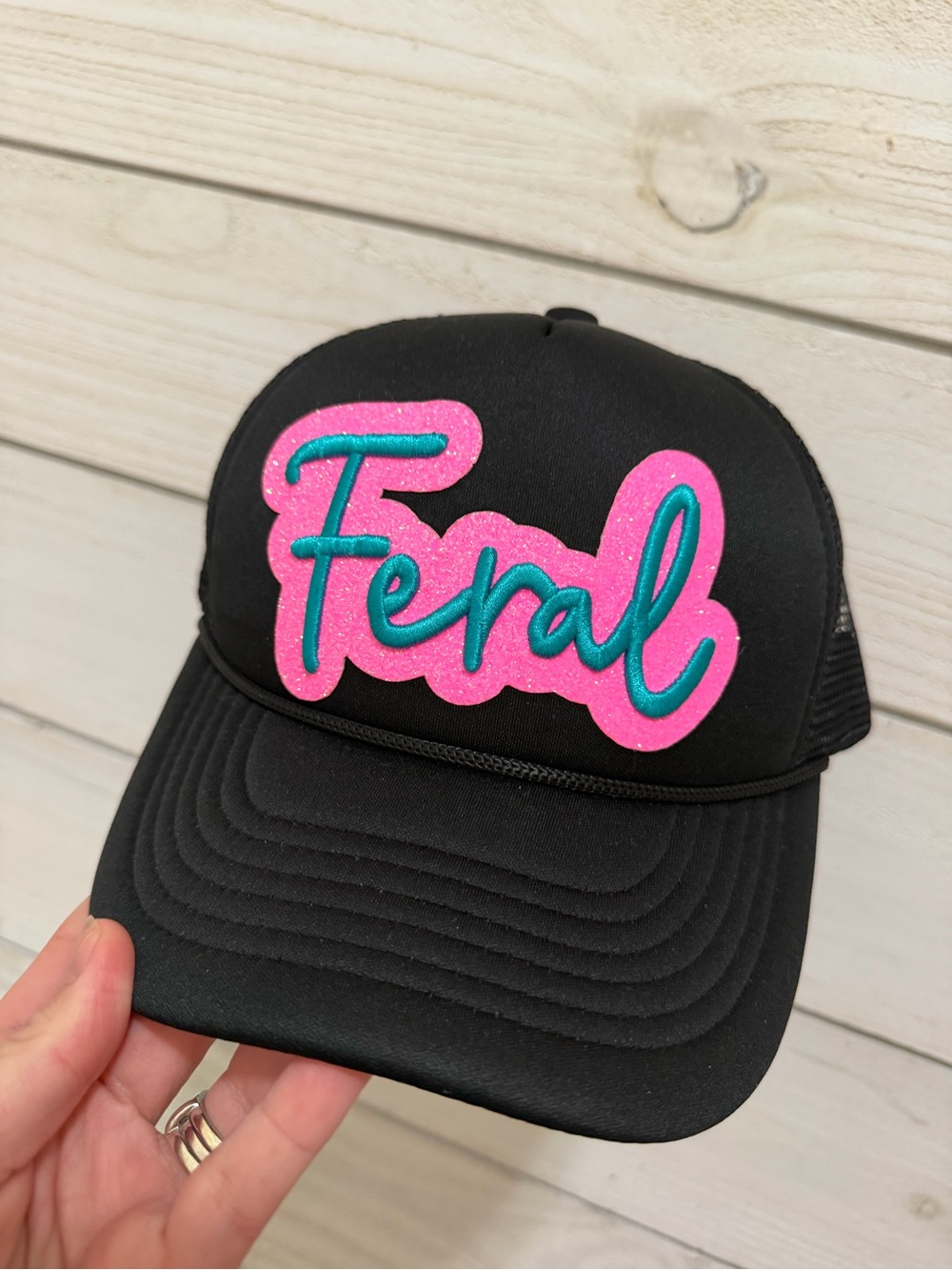 Black Trucker Hat with Pink & Teal 'Feral' Patch